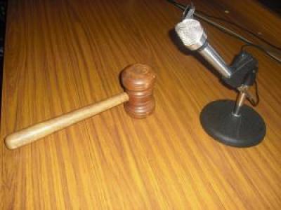 Gavel on a desk in front of a microphone